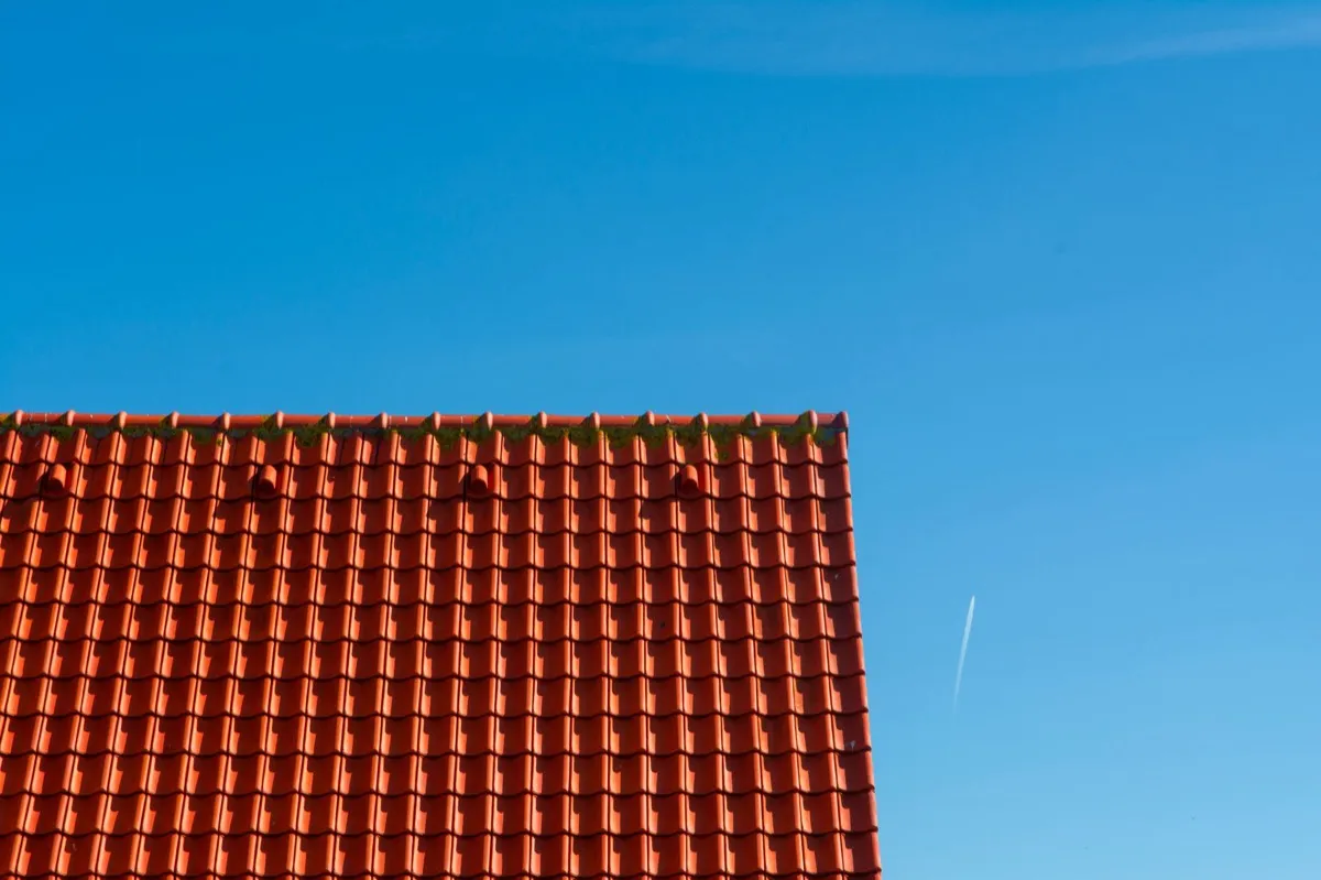 Tile roof gable in full sun, the kind of exposure that sets roof life in Santa Fe, NM